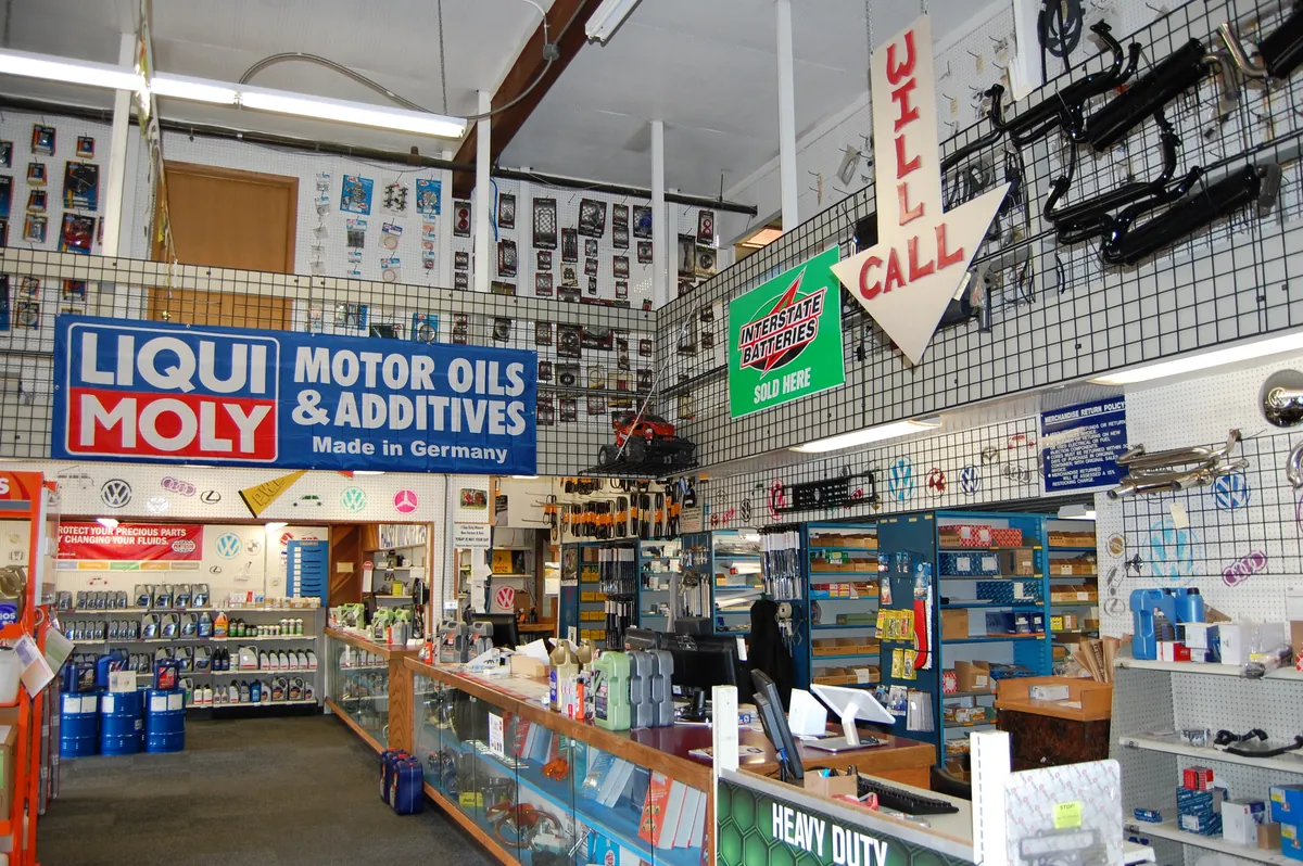 Inside Halsey Import Parts: the parts counter with shelves of oils, additives and import parts