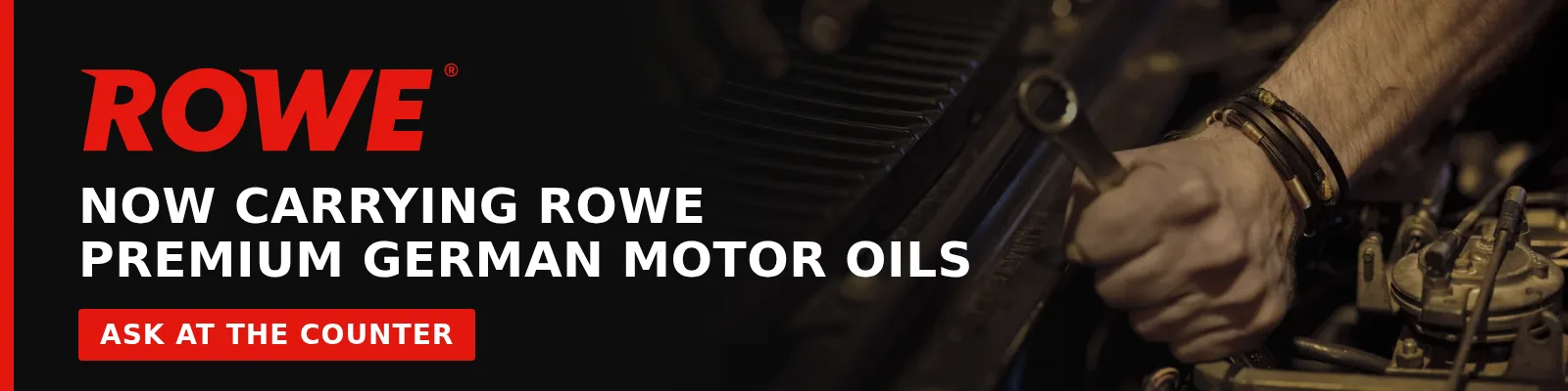 ROWE banner reading “Now carrying ROWE premium German motor oils — Ask at the counter” over a photo of a mechanic working on an engine